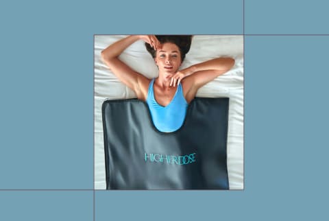 HigherDose infrared sauna blanket on blue background