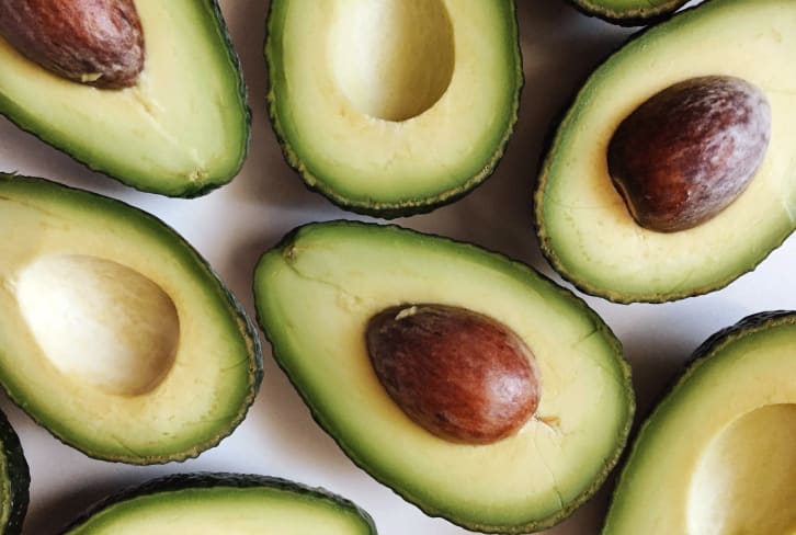 Try This Genius Hack For Removing An Avocado Pit (Without A Knife)