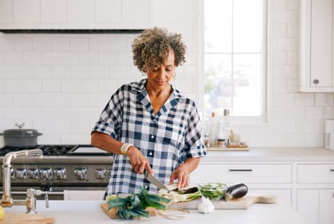 Senior Woman Cooking In The Kitchen